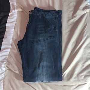 Blue tapered jeans.